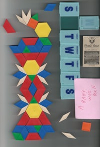 a stack of colorful blocks and a piece of paper