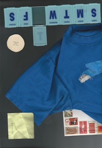 a blue t - shirt with a sticker on it